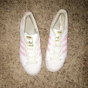 Pink and white super star adidas